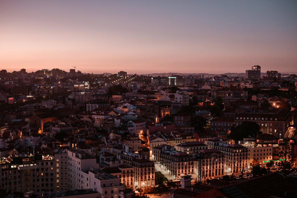 Overhead View Of City Skyline With Pink Sunset Behind Photo Overhead View Of City Skyline With Pink Sunset Behind Photo