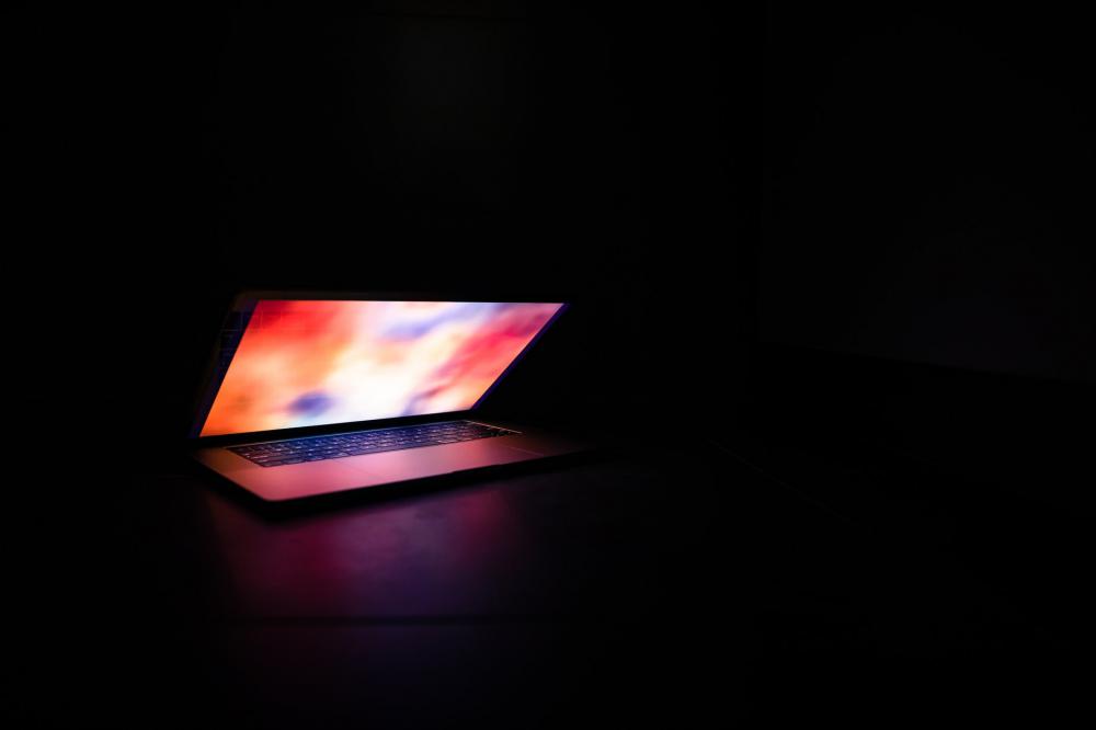 Illuminated Laptop In The Dark Photo Illuminated Laptop In The Dark Photo