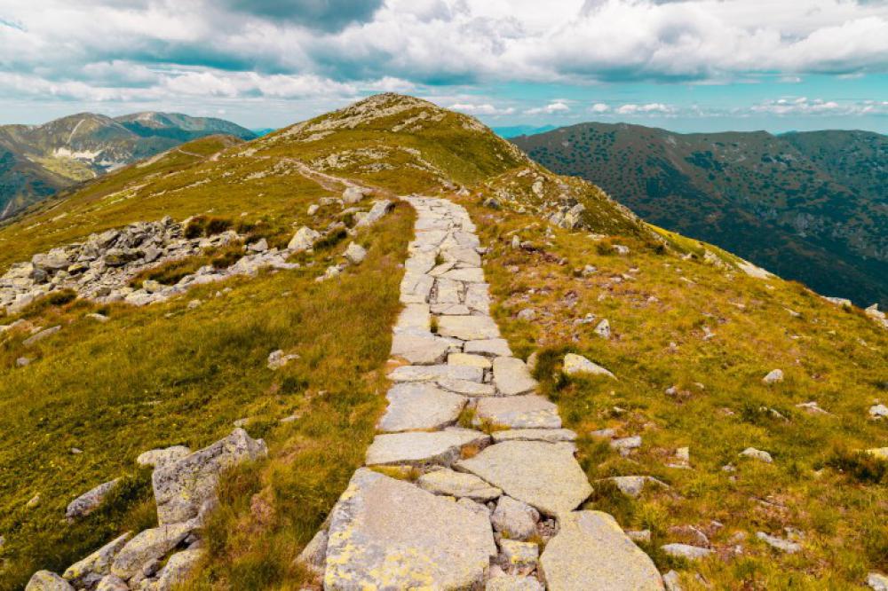 Beautiful landscape with a lane between rocky mountains Beautiful landscape with a lane between rocky mountains