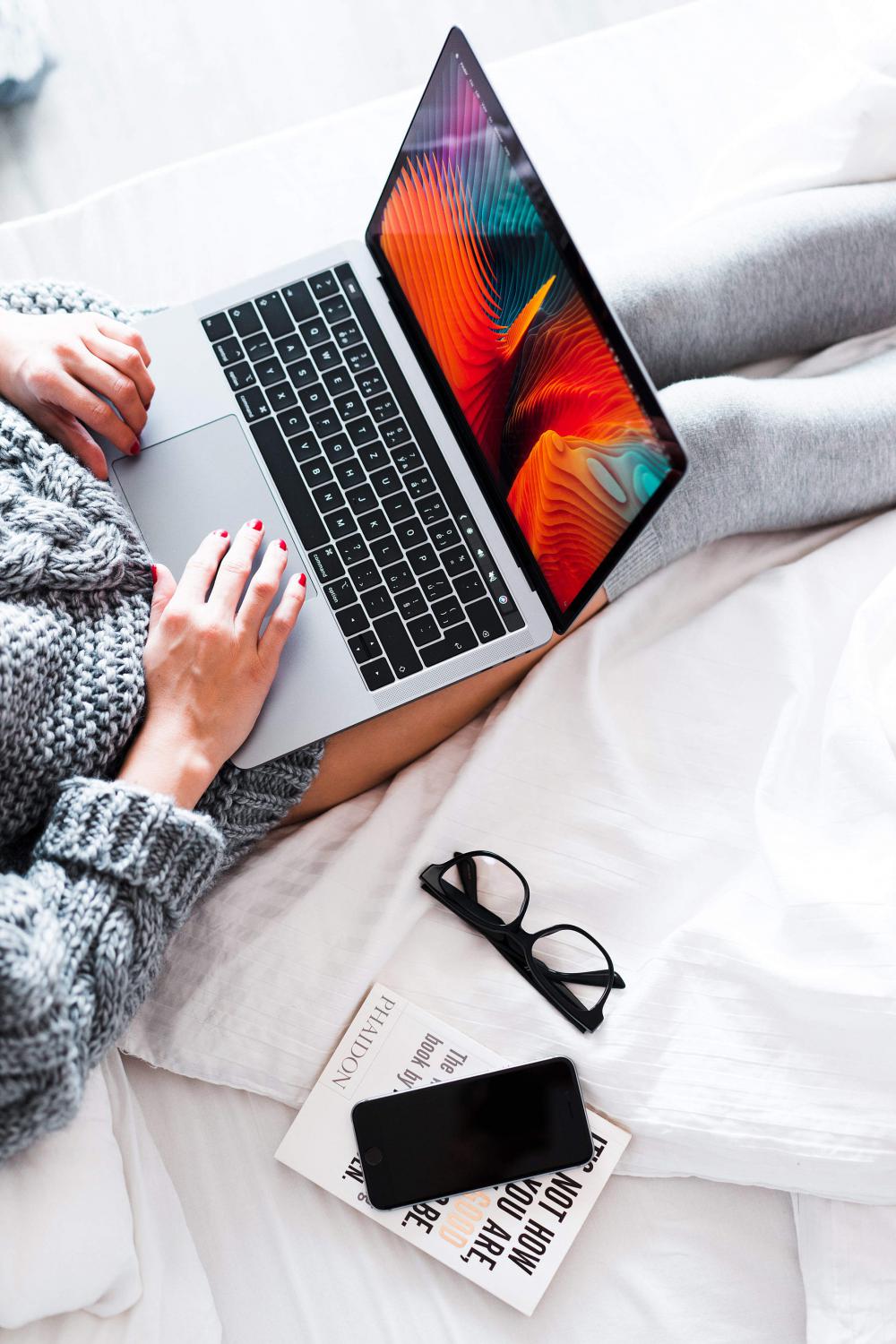 Woman Using Her New MacBook in Bed Free Photo Woman Using Her New MacBook in Bed Free Photo
