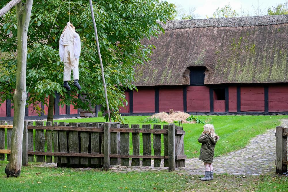 Little Girl Scared By Hangman Halloween Decoration Little Girl Scared By Hangman Halloween Decoration