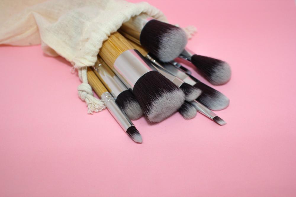 Paintbrushes Of Different Sizes Spill Onto A Pink Table Photo Paintbrushes Of Different Sizes Spill Onto A Pink Table Photo