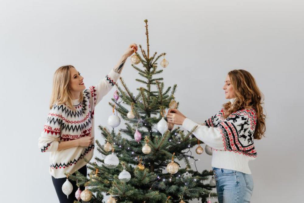 Women Decorate Christmas Trees Women Decorate Christmas Trees