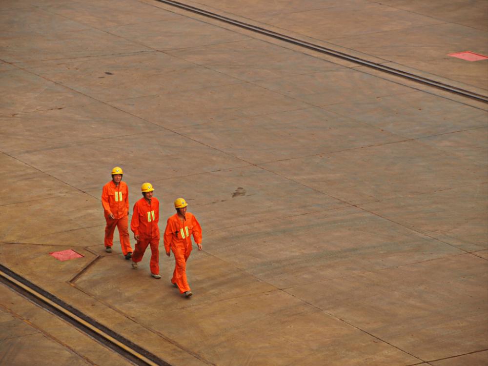 workers helmets outdoors industrial tarmac workers helmets outdoors industrial tarmac