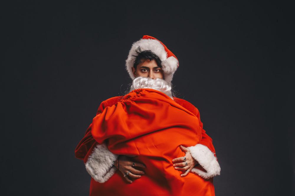 Dressed As Santa Clutches Sack Photo Dressed As Santa Clutches Sack Photo
