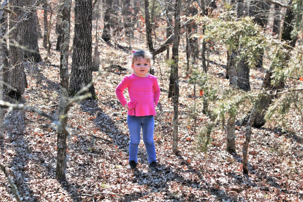Little Girl Standing In The Woods Little Girl Standing In The Woods