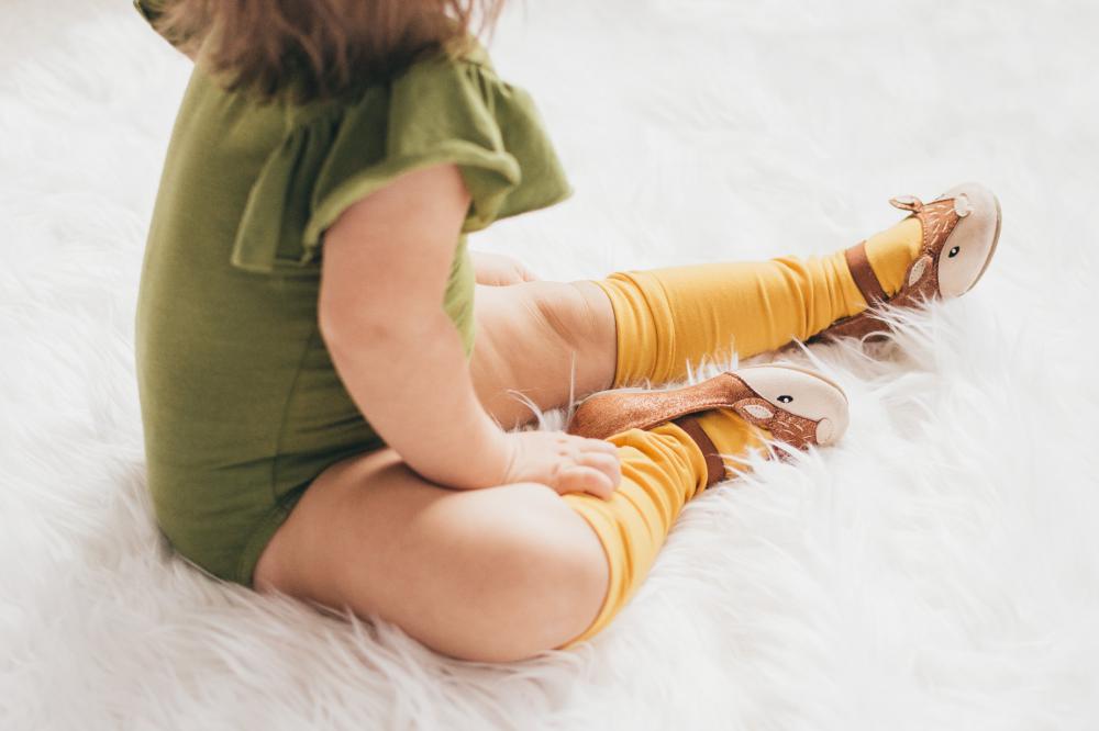 Child Sits On Fluffy Rug Photo Child Sits On Fluffy Rug Photo