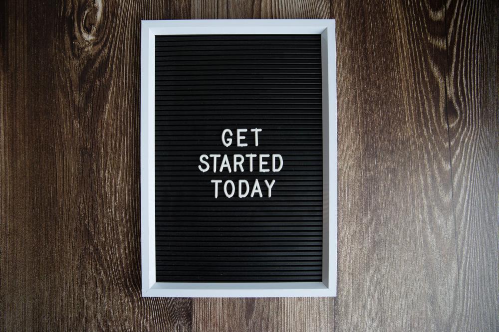 Get Started Today Sign On Dark Wood Photo Get Started Today Sign On Dark Wood Photo