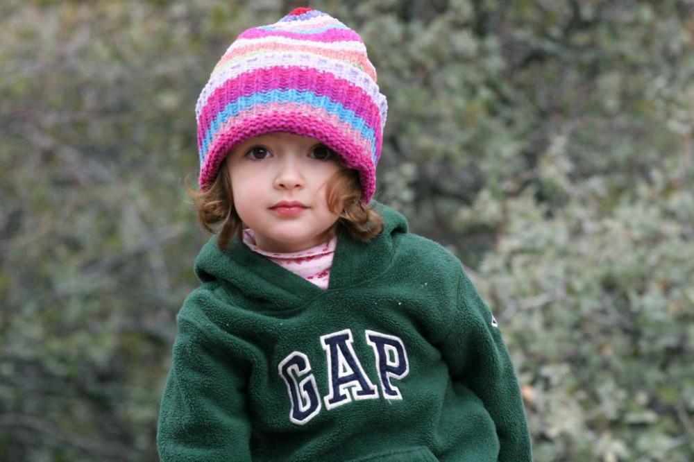 Little kid in a knit cap Little kid in a knit cap