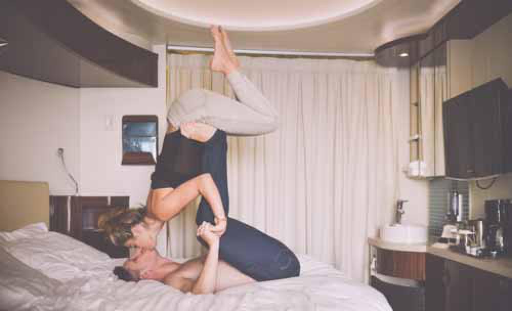 Man And Woman Kissing Whilst Playing On A Hotel Bed Man And Woman Kissing Whilst Playing On A Hotel Bed