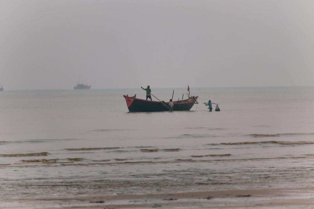 Fishermen On The Shoreline Photo Fishermen On The Shoreline Photo