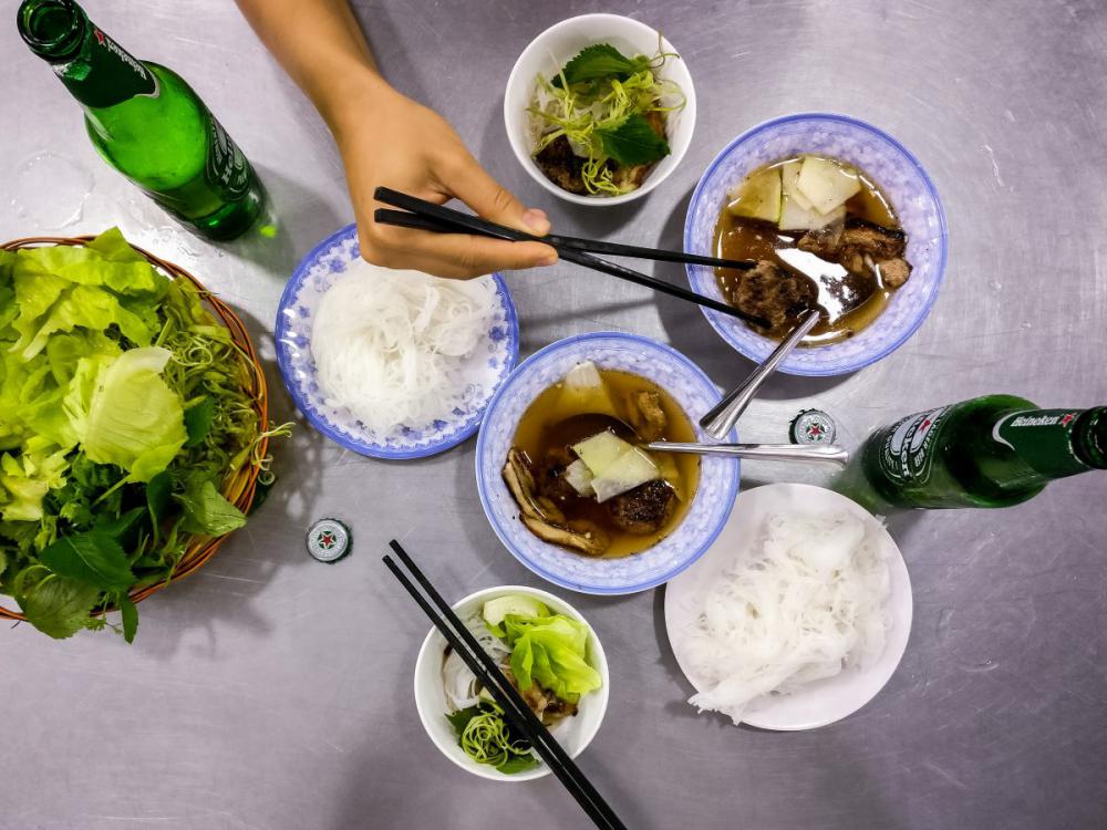 Eating delicious Vietnamese Bun Cha noodles with pork Eating delicious Vietnamese Bun Cha noodles with pork