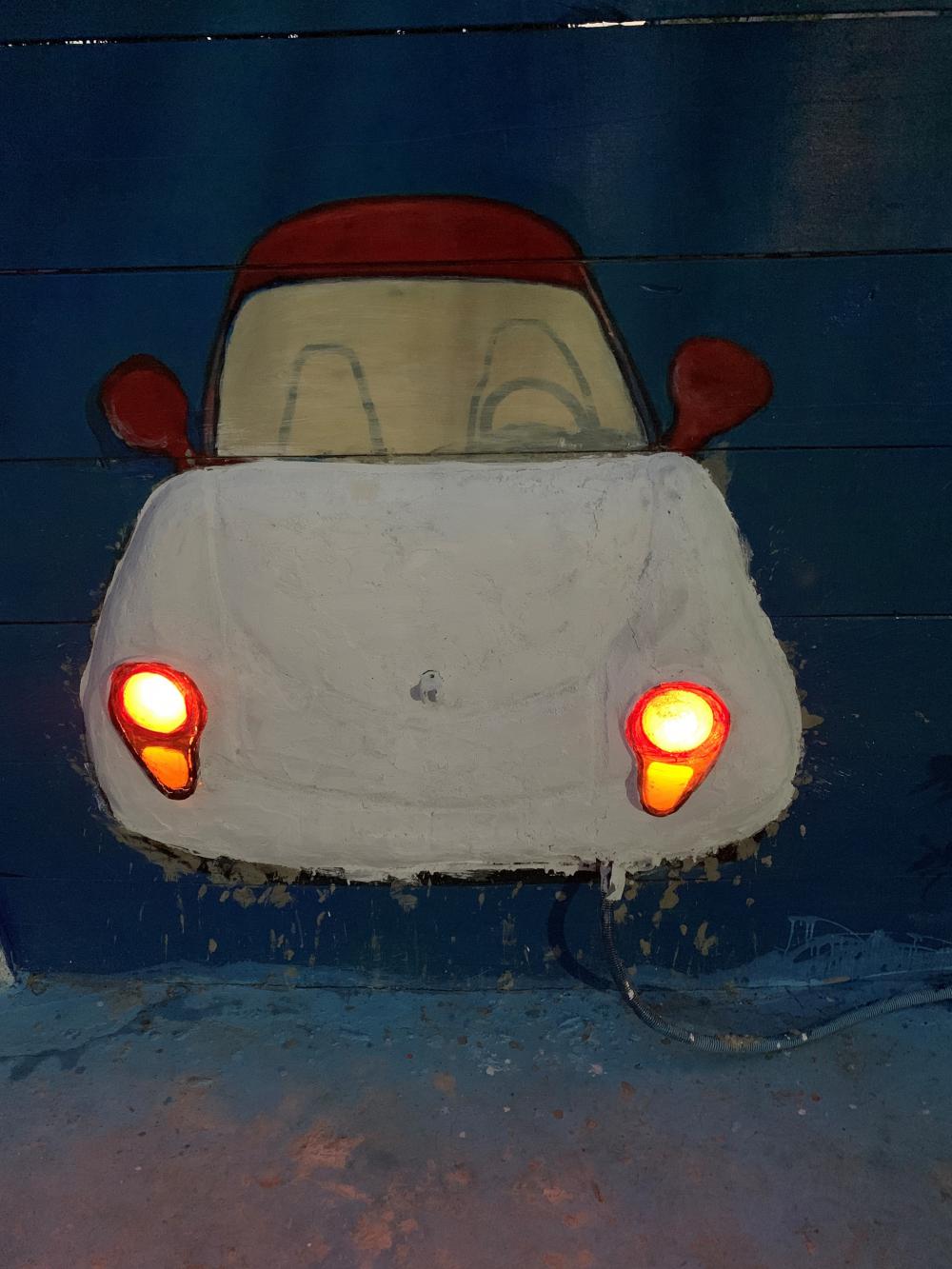 cartoon car, painted wall, headlight, artistic, DIY, handmade cartoon car, painted wall, headlight, artistic, DIY, handmade