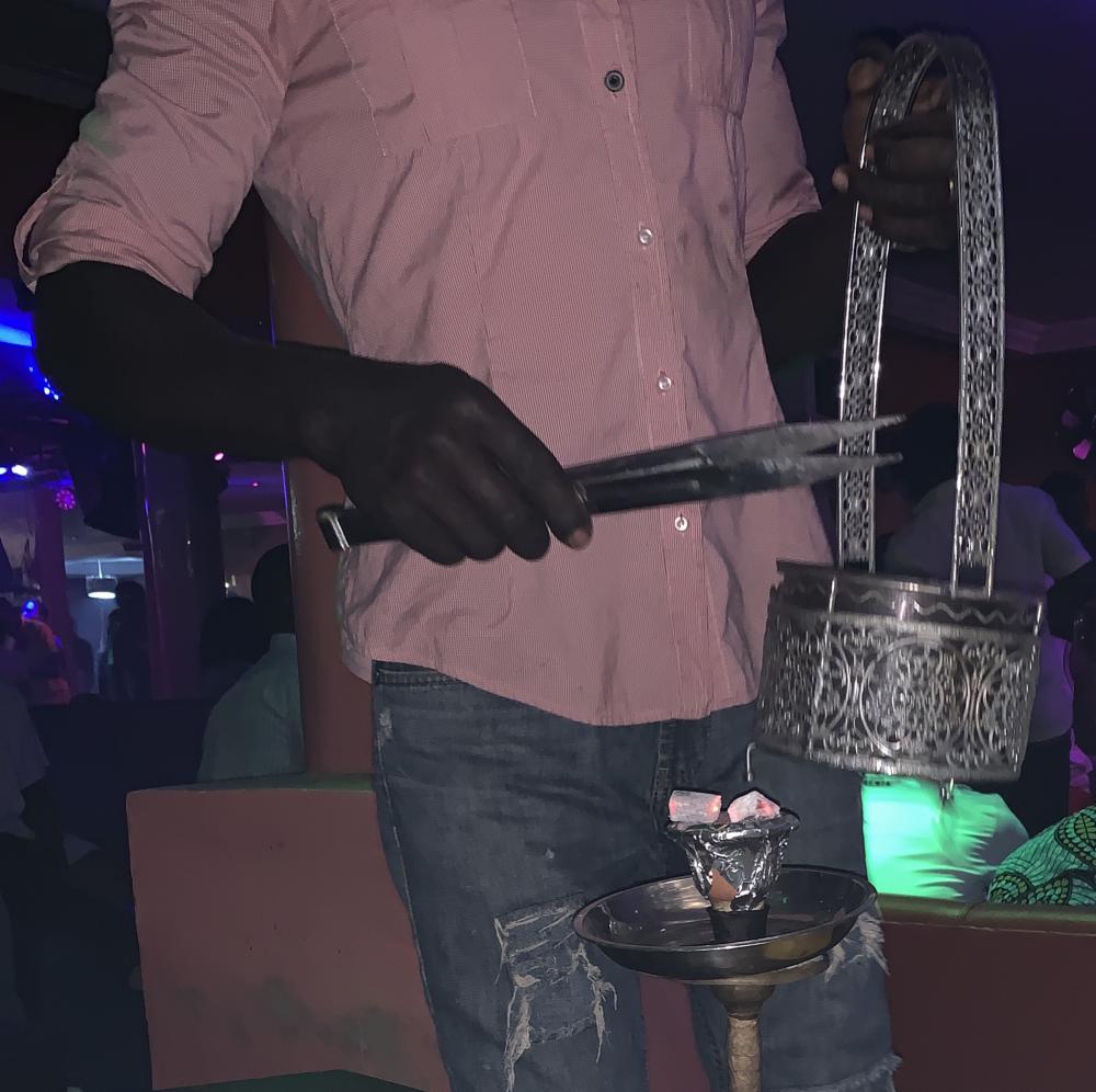 man, embers, chicha, give fire, charcoal, bar, people, smoking man, embers, chicha, give fire, charcoal, bar, people, smoking
