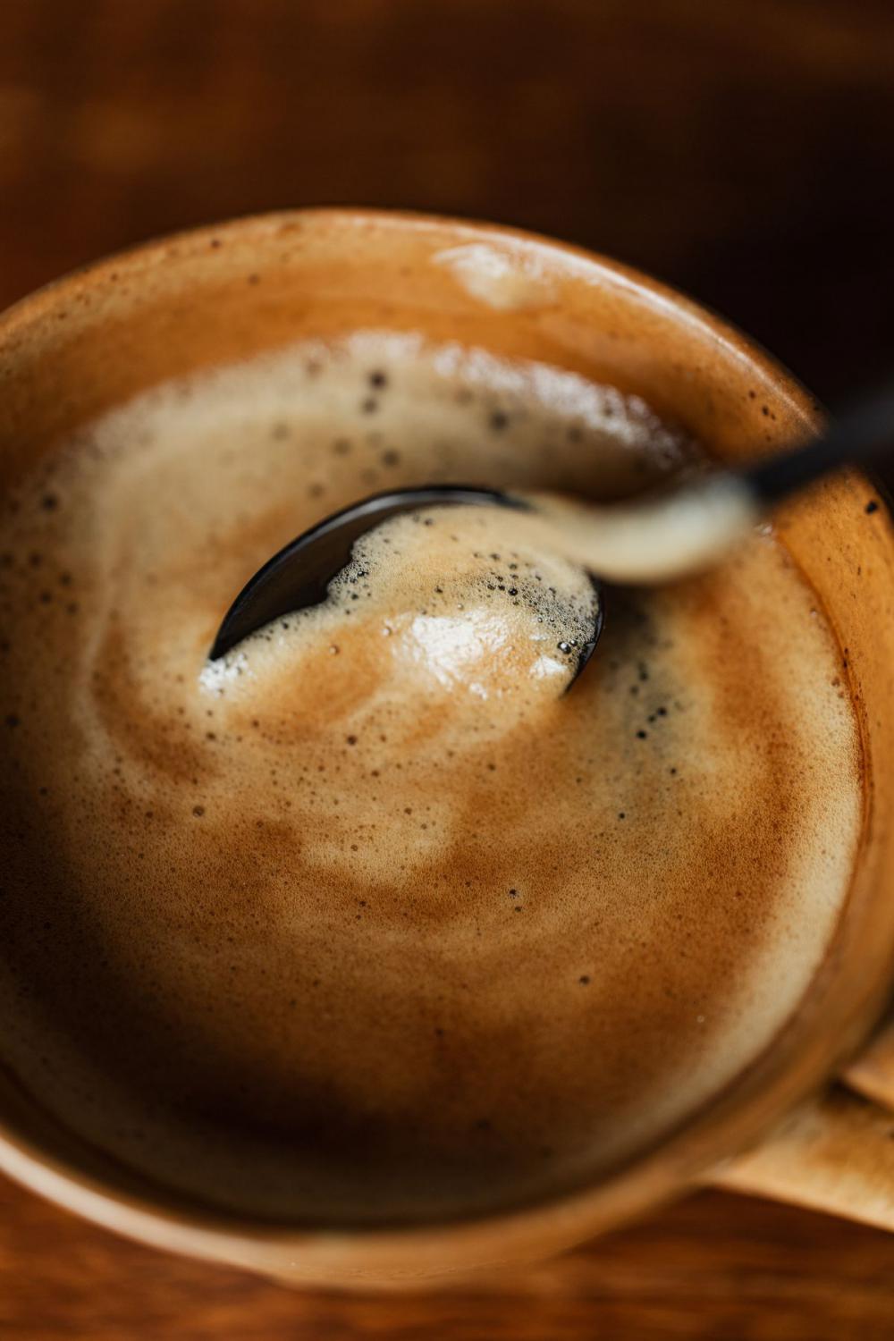 Cup of coffee on wooden table Cup of coffee on wooden table