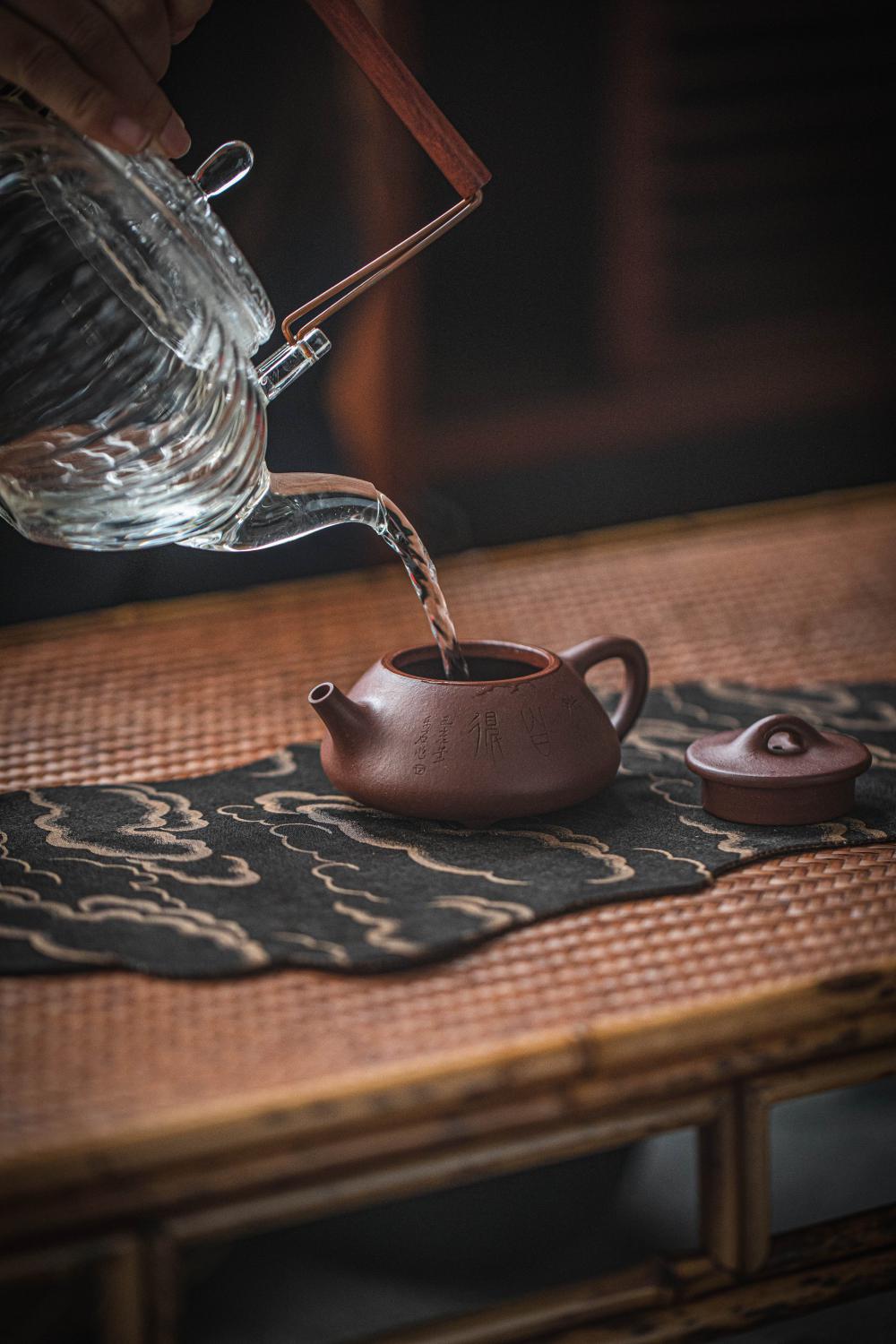 Water Poured From One Teapot To Another Photo Water Poured From One Teapot To Another Photo