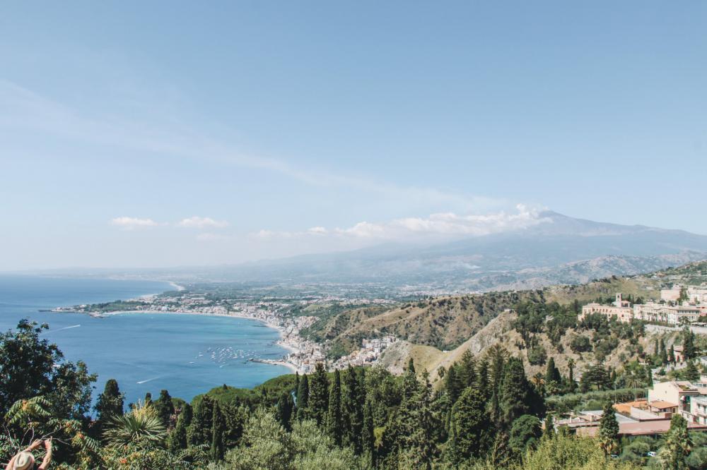 Sunny Coastline Below Distant Mountains Photo Sunny Coastline Below Distant Mountains Photo