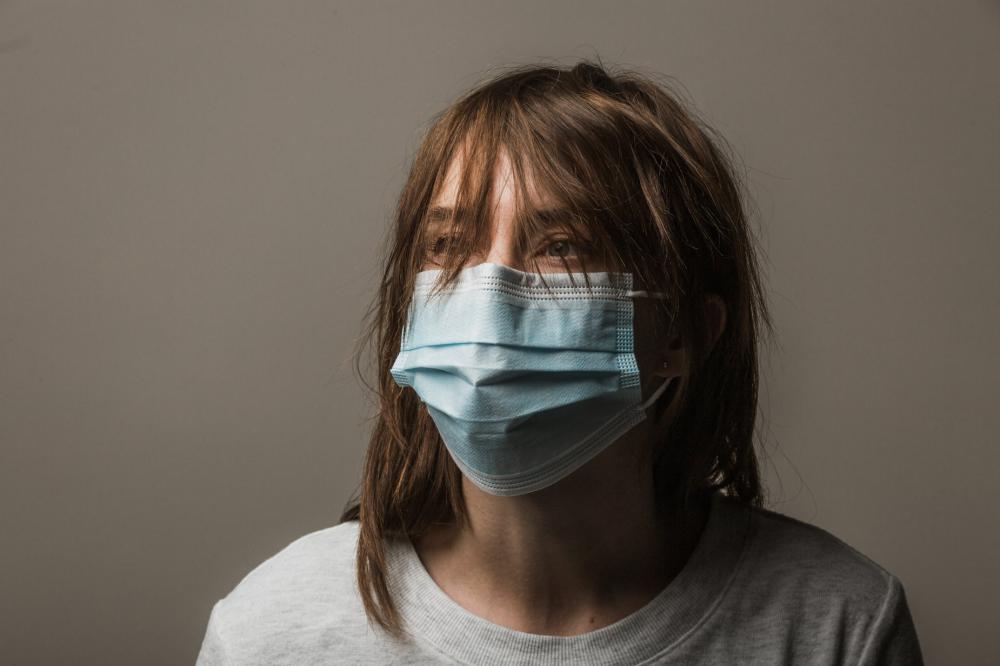 Woman Wearing Disposable Face Mask Photo Woman Wearing Disposable Face Mask Photo