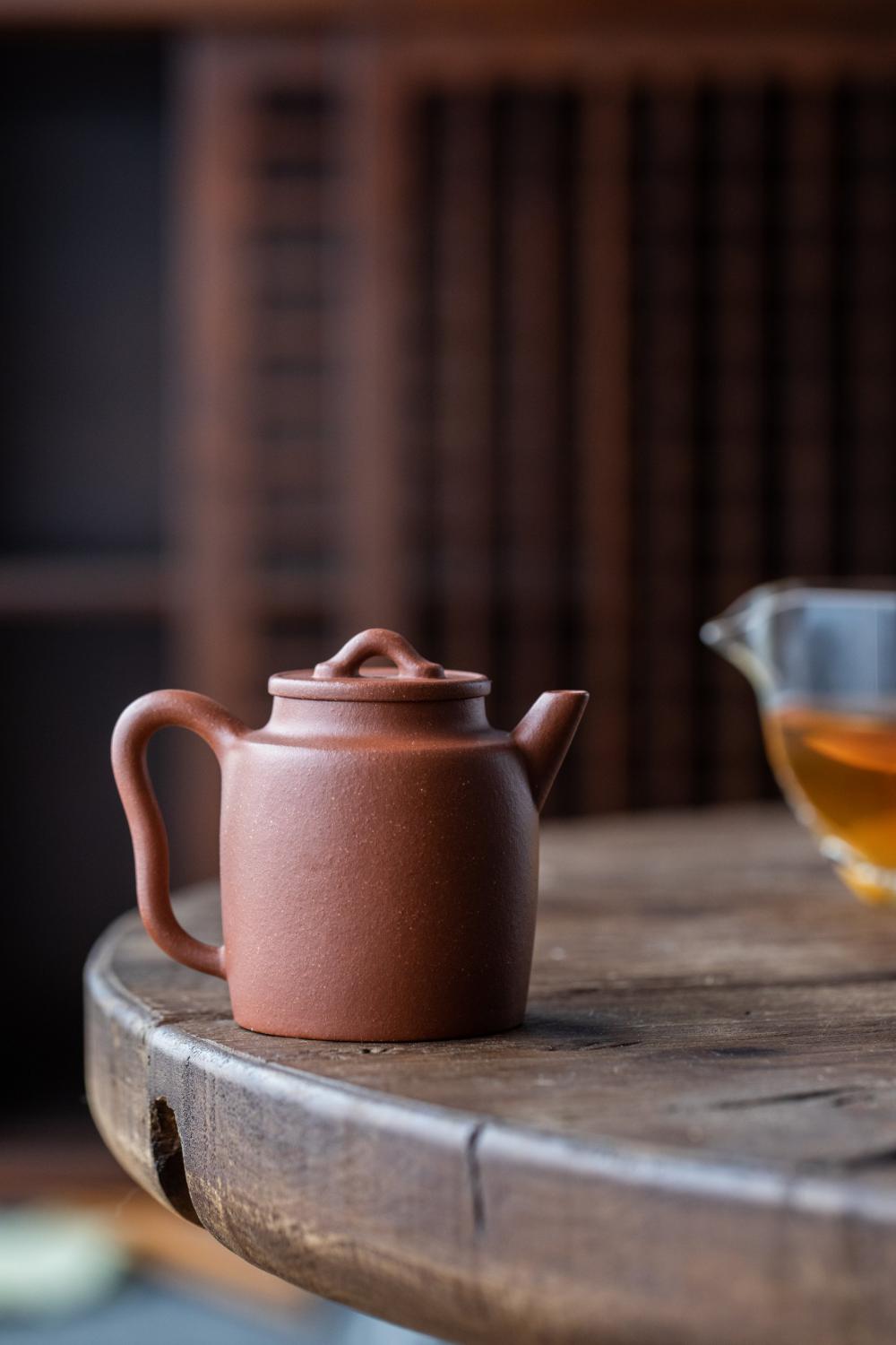 A Dark Ceramic Teapot On A Wooden Table Photo A Dark Ceramic Teapot On A Wooden Table Photo