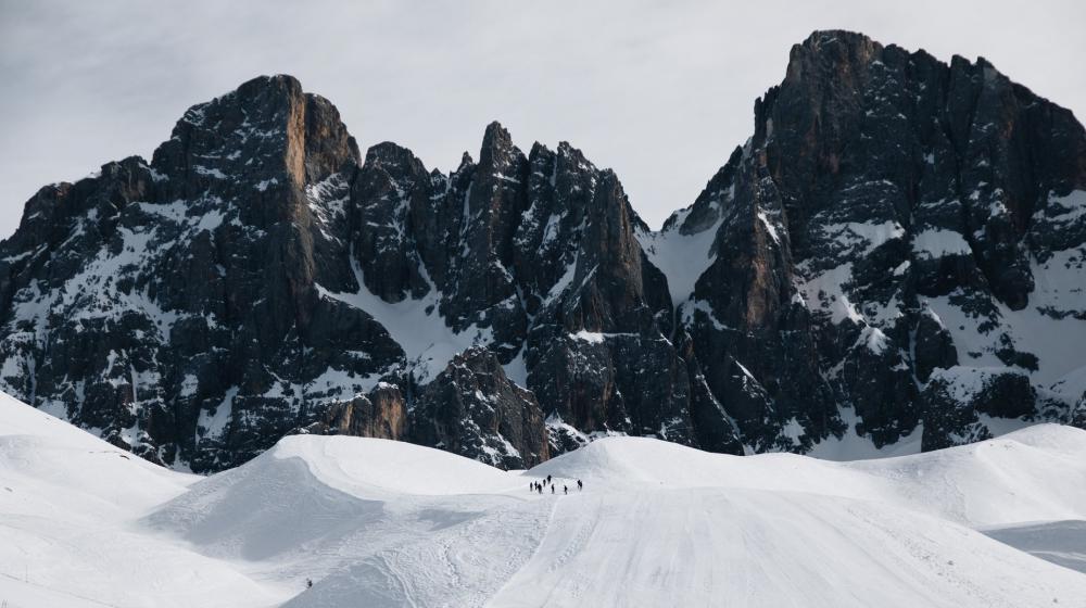 Snow Covered Mountains With Hikers Photo Snow Covered Mountains With Hikers Photo