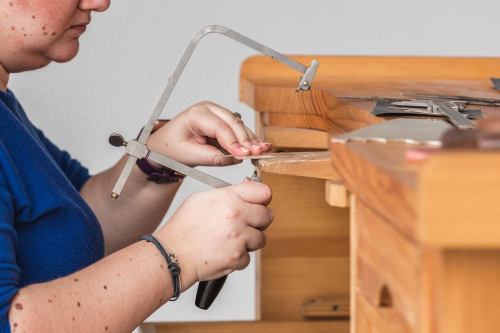 Woman Using A Coping Saw Photo Woman Using A Coping Saw Photo