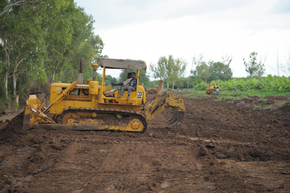 men, people, field, tractor, mechanical agriculture, work, farmers, production, clearing, plowing the land men, people, field, tractor, mechanical agriculture, work, farmers, production, clearing, plowing the land