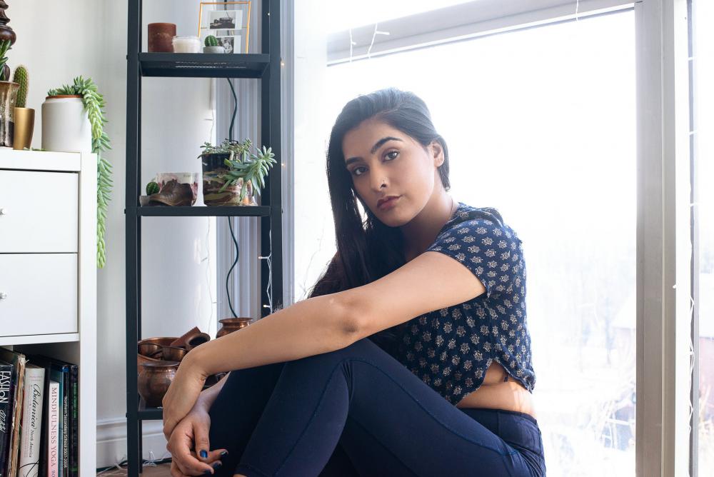 Young Woman In Front Of Bright Window Photo Young Woman In Front Of Bright Window Photo