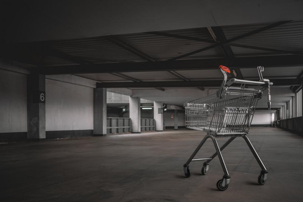 Abandoned Shopping Cart In Parking Lot Photo Abandoned Shopping Cart In Parking Lot Photo