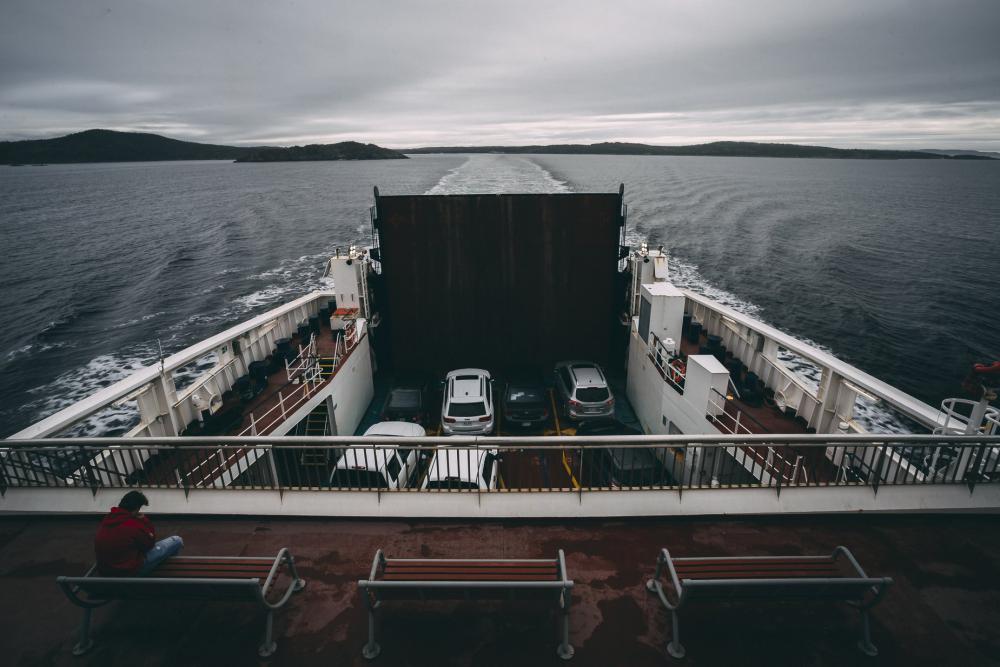 Sitting Atop A Ferry Travelling Across Water Photo Sitting Atop A Ferry Travelling Across Water Photo
