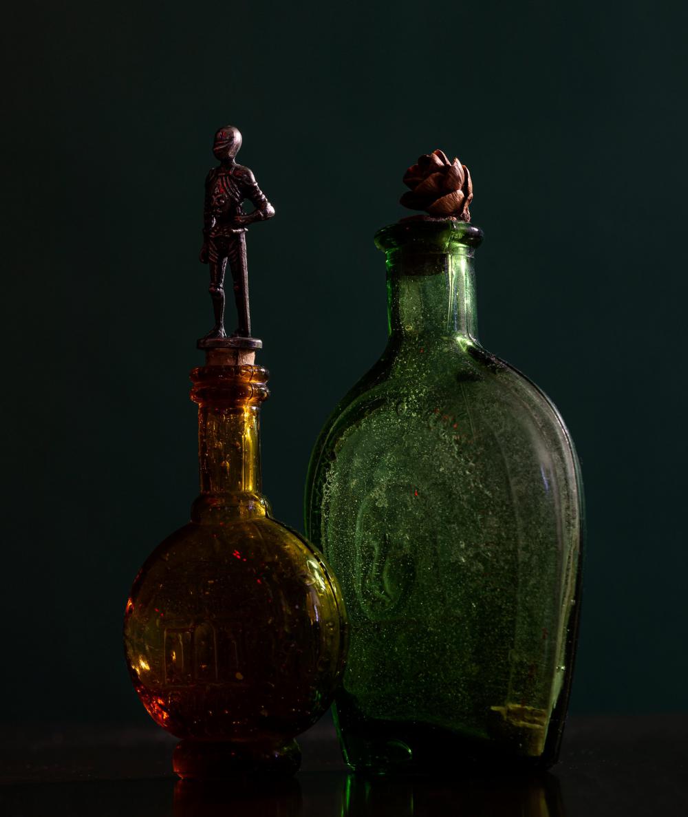 Two Glass Bottles With Ornate Tops Photo Two Glass Bottles With Ornate Tops Photo