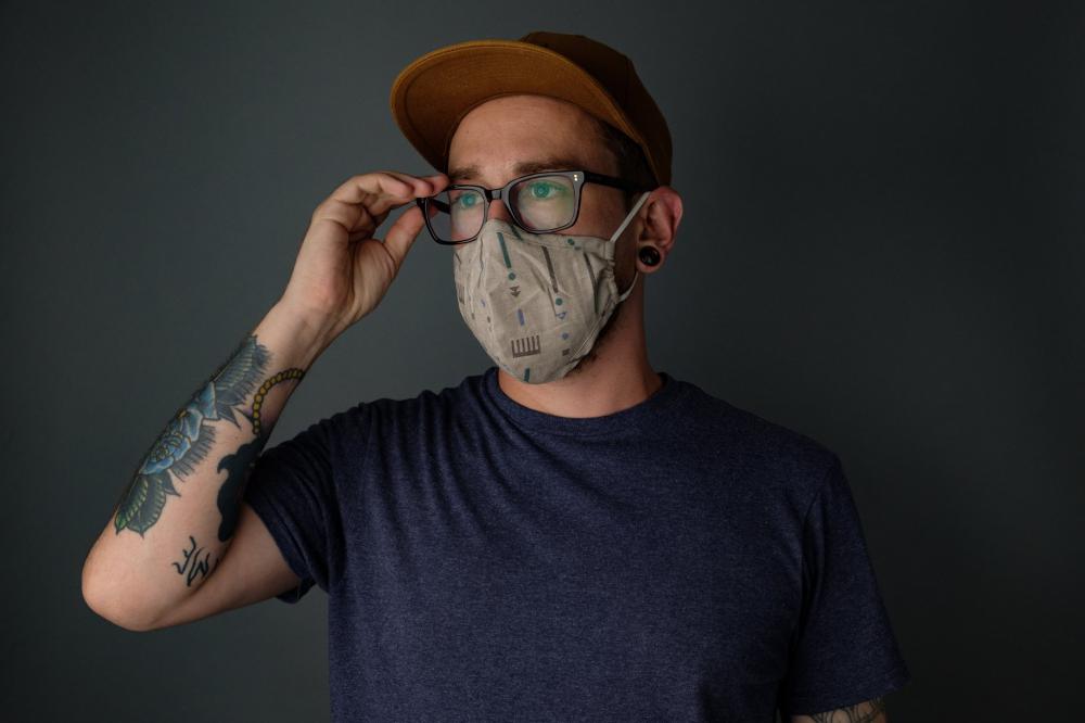 Man Wearing Mask Adjusting His Glasses Photo Man Wearing Mask Adjusting His Glasses Photo