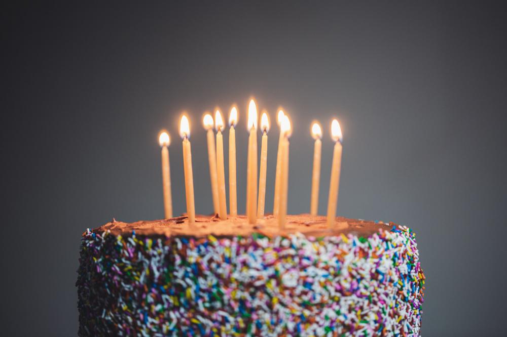 Candles Lit On Chocolate Cake Photo Candles Lit On Chocolate Cake Photo