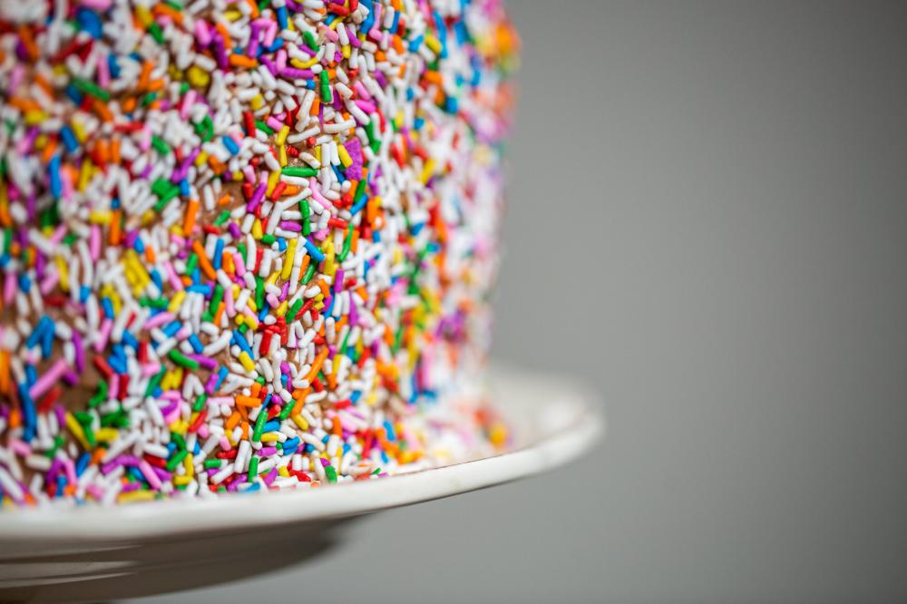 Sprinkles On A Chocolate Cake With Plate Photo Sprinkles On A Chocolate Cake With Plate Photo