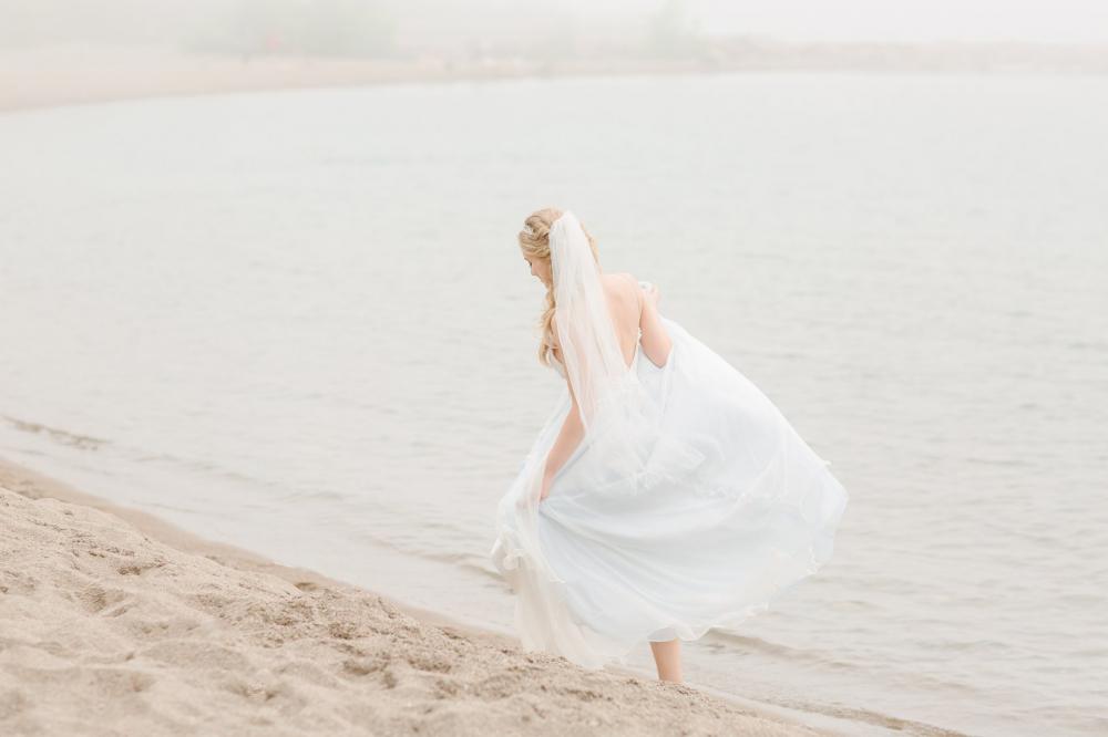 Bride Taking A Walk Along The Beach Photo Bride Taking A Walk Along The Beach Photo