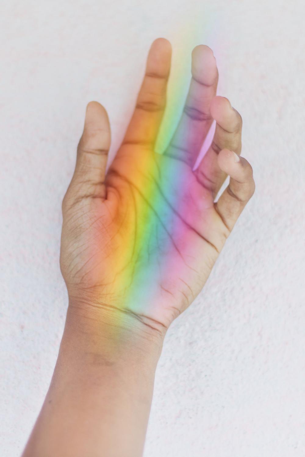 Hand Holding A Rainbow Photo Hand Holding A Rainbow Photo