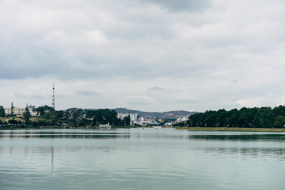 Buildings Line Lake Side With Mountains Photo Buildings Line Lake Side With Mountains Photo