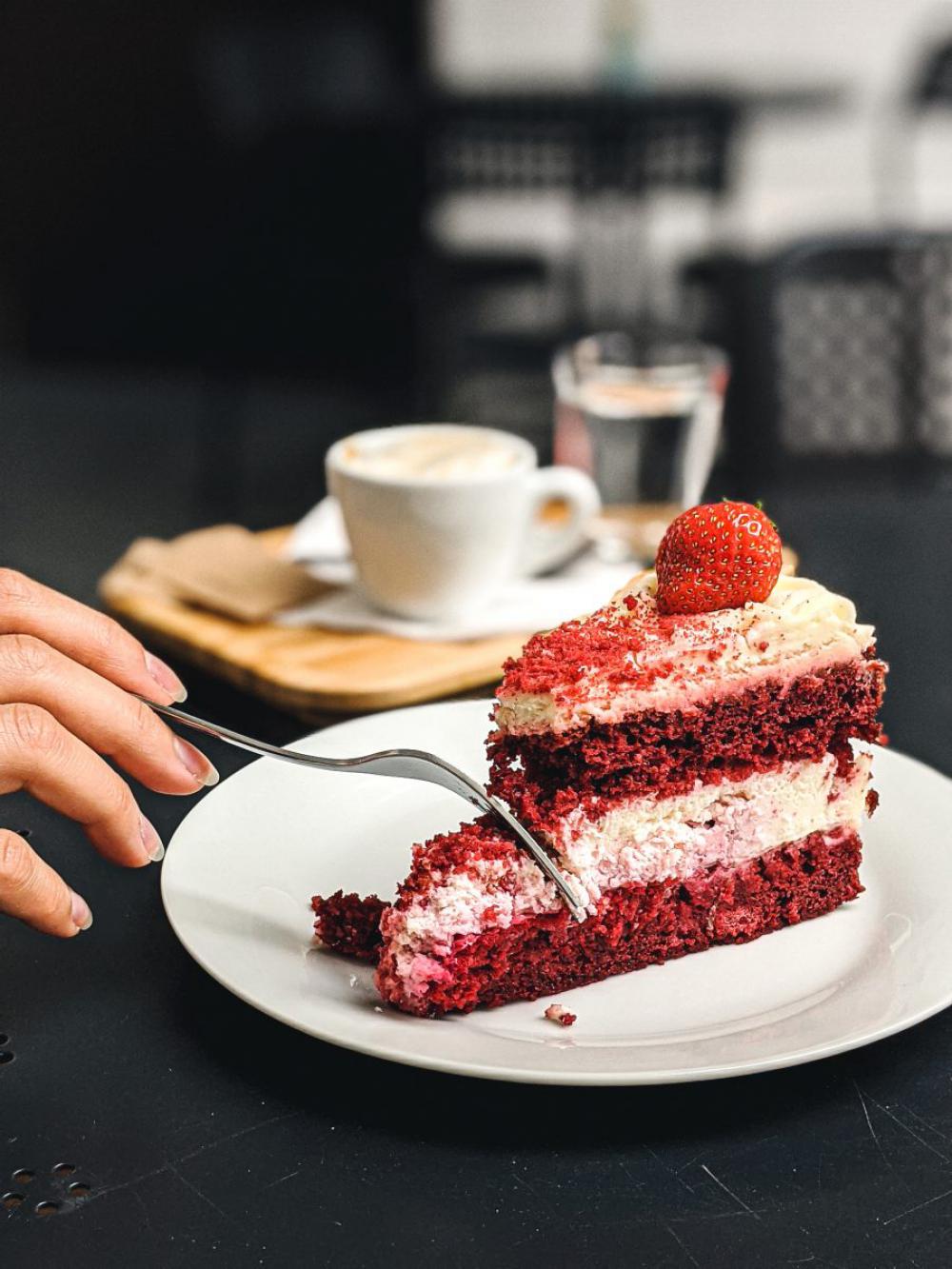 Girl eating strawberry Pavlova cake Girl eating strawberry Pavlova cake