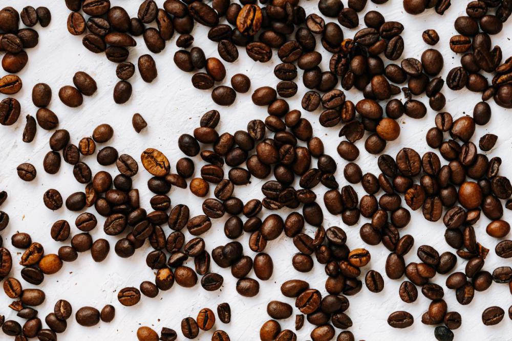Dark roast coffee beans background Dark roast coffee beans background