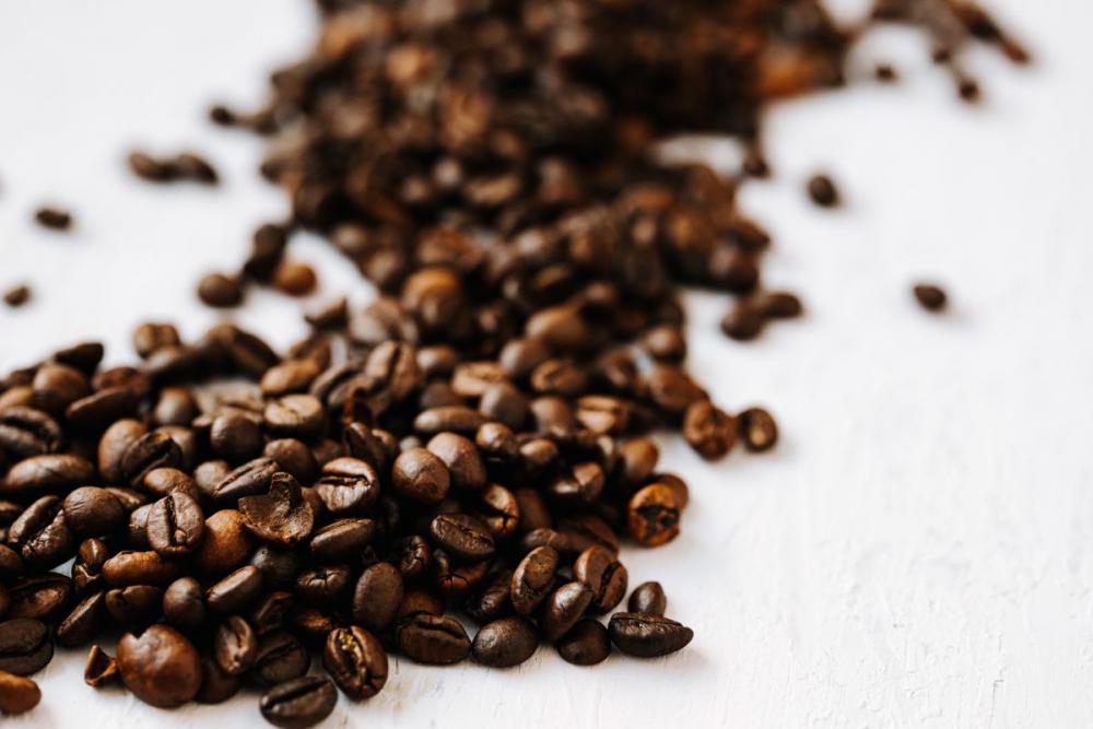 Dark roast coffee beans background Dark roast coffee beans background