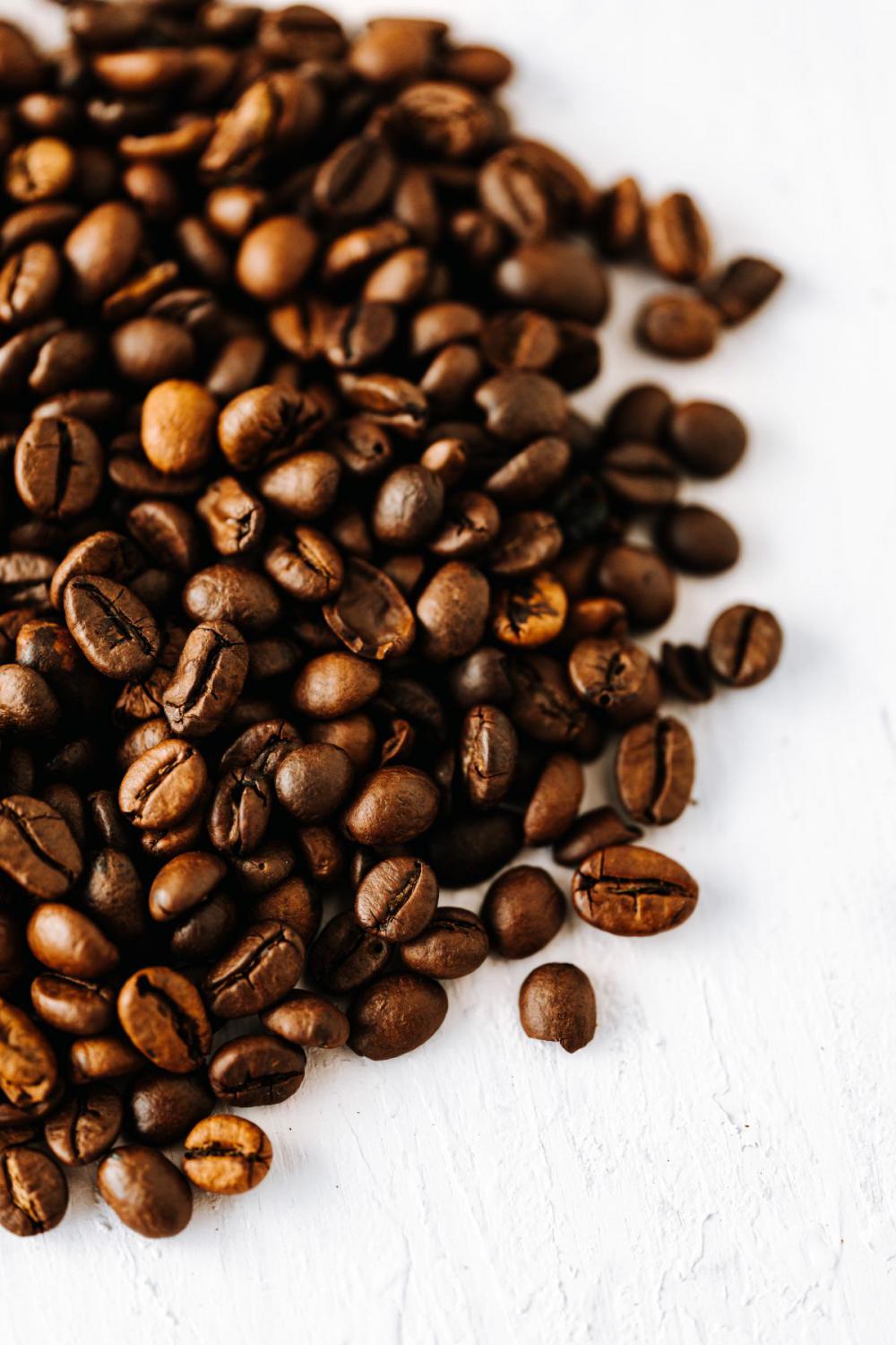 Dark roast coffee beans background Dark roast coffee beans background