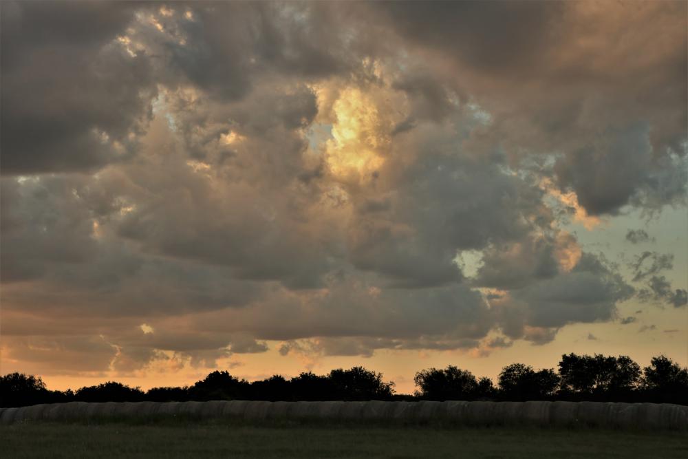 Storm Clouds Over Hay Bales Storm Clouds Over Hay Bales