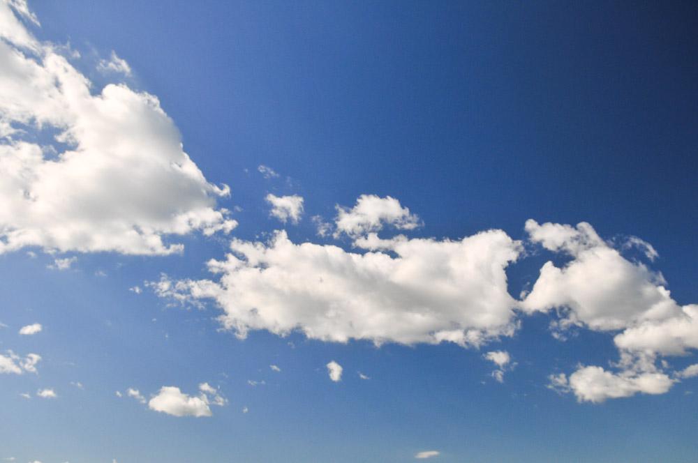 White Fluffy Clouds In A Blue Sky White Fluffy Clouds In A Blue Sky