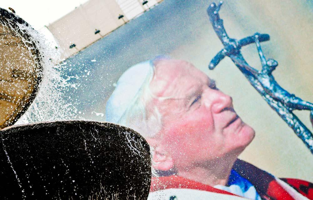 Pope On Poster Next To A Fountain Pope On Poster Next To A Fountain
