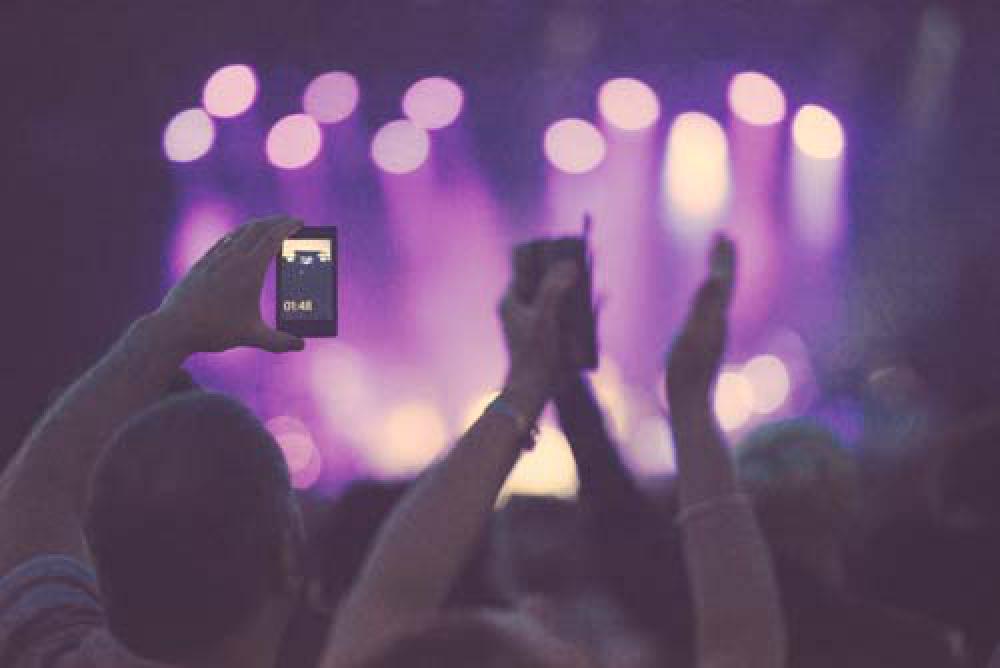 Man Recording Music Concert On Smart Phone Man Recording Music Concert On Smart Phone