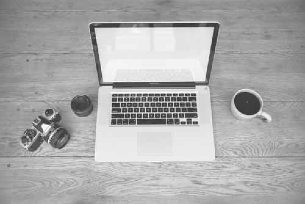 Laptop, Coffee And Retro Film Camera On Wooden Desk Laptop, Coffee And Retro Film Camera On Wooden Desk