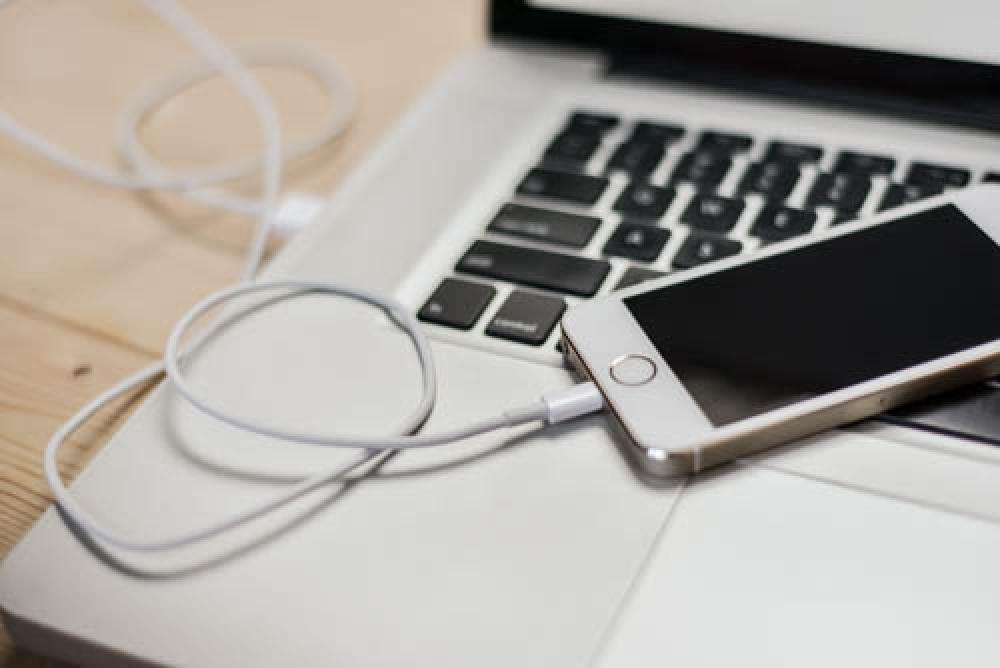 iPhone On Keyboard Connected To Laptop iPhone On Keyboard Connected To Laptop