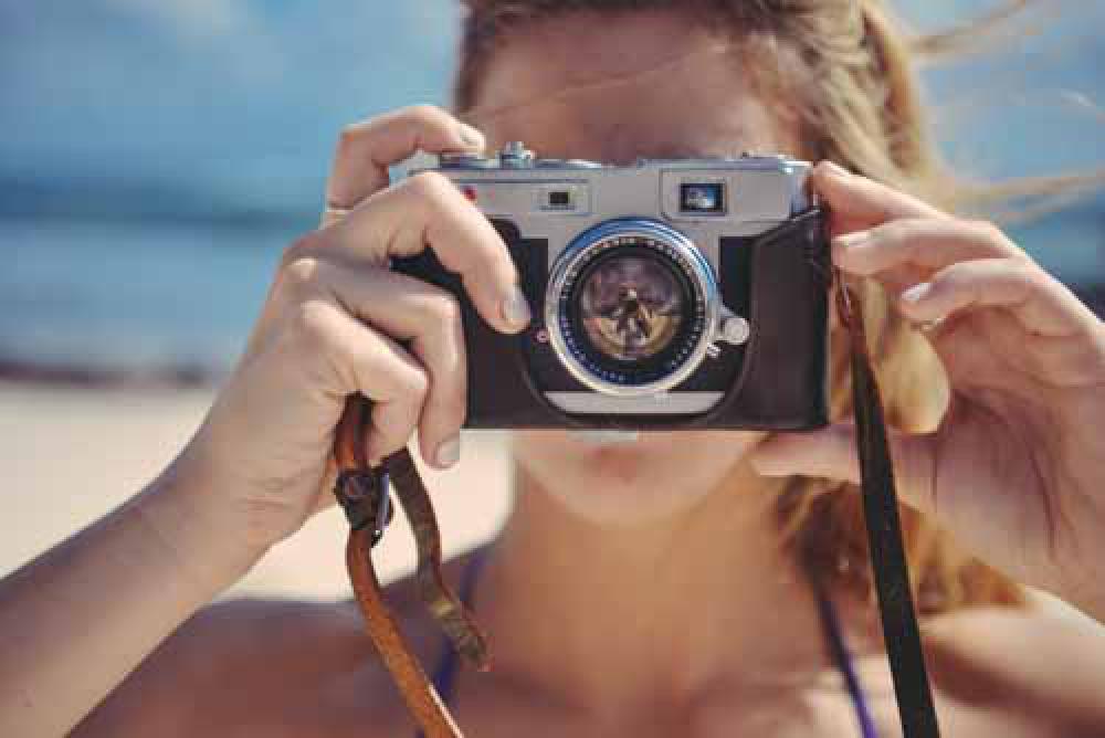 Blond Girl Taking Photo With Retro Camera In The Sun Blond Girl Taking Photo With Retro Camera In The Sun