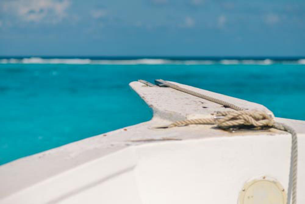 Blue Ocean With Bow Of White Boat And Rope Blue Ocean With Bow Of White Boat And Rope