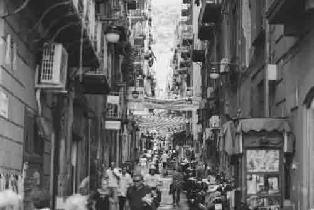 Busy italian Back Street With People and Buildings Busy italian Back Street With People and Buildings