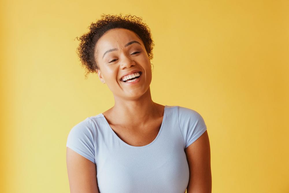 Young Woman With Bright Smile Photo Young Woman With Bright Smile Photo